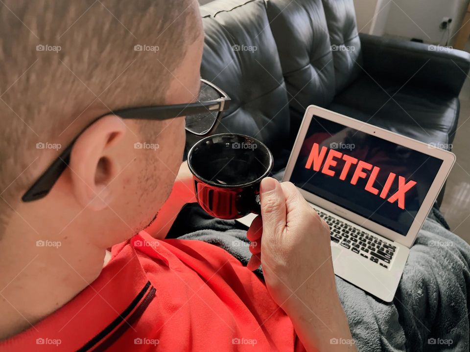 man watching series on computer