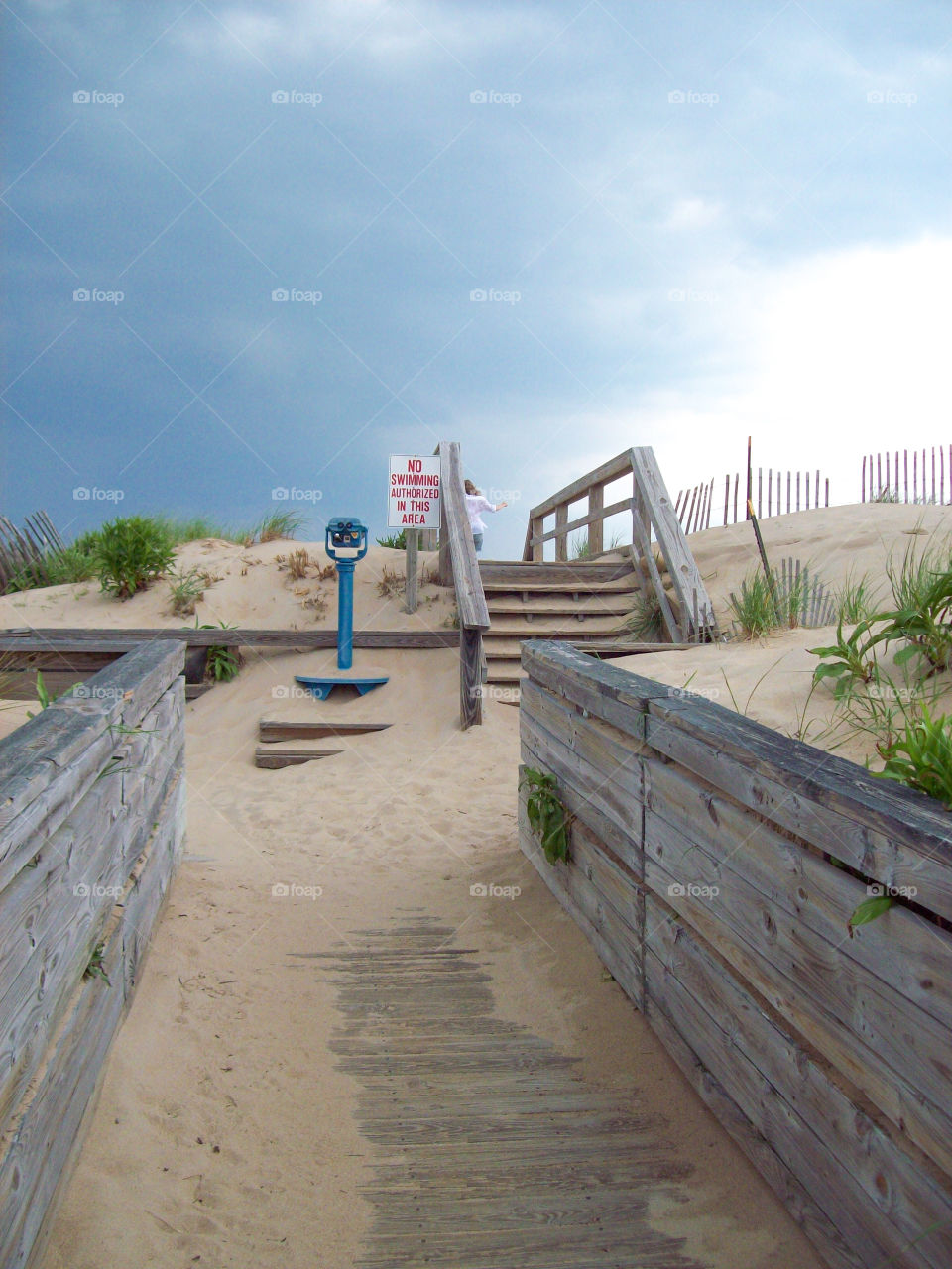 Sand covered walkway to the beach