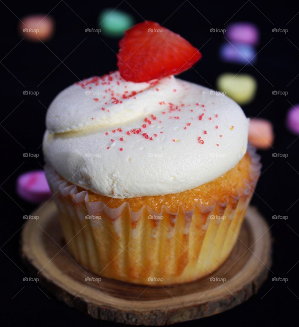 Strawberry on top of cupcake