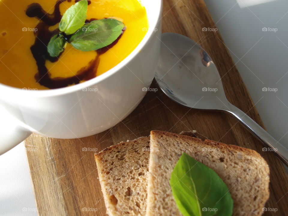 hot pumpkin soup to warm up with basil and fresh bread