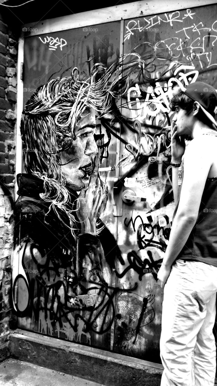 Black and white have a smoke