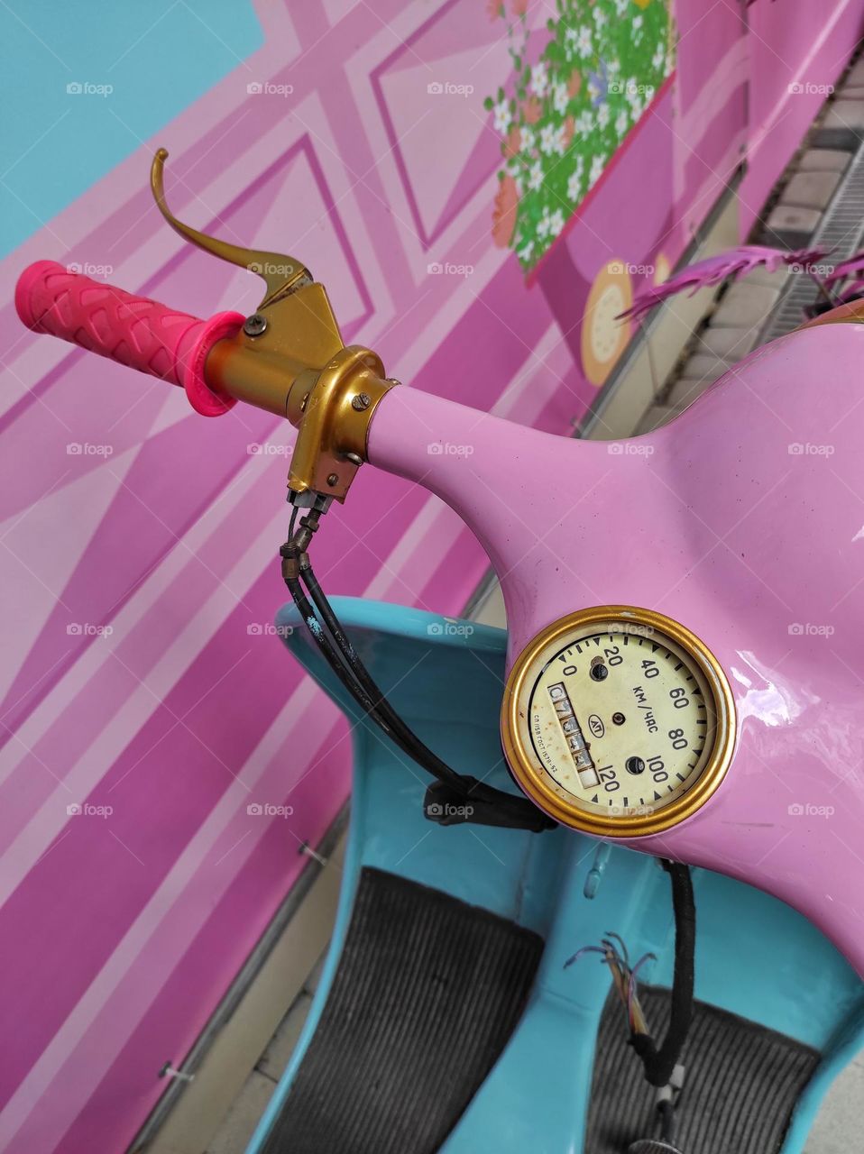 Pink motorcycle in the style of Barbie close-up
