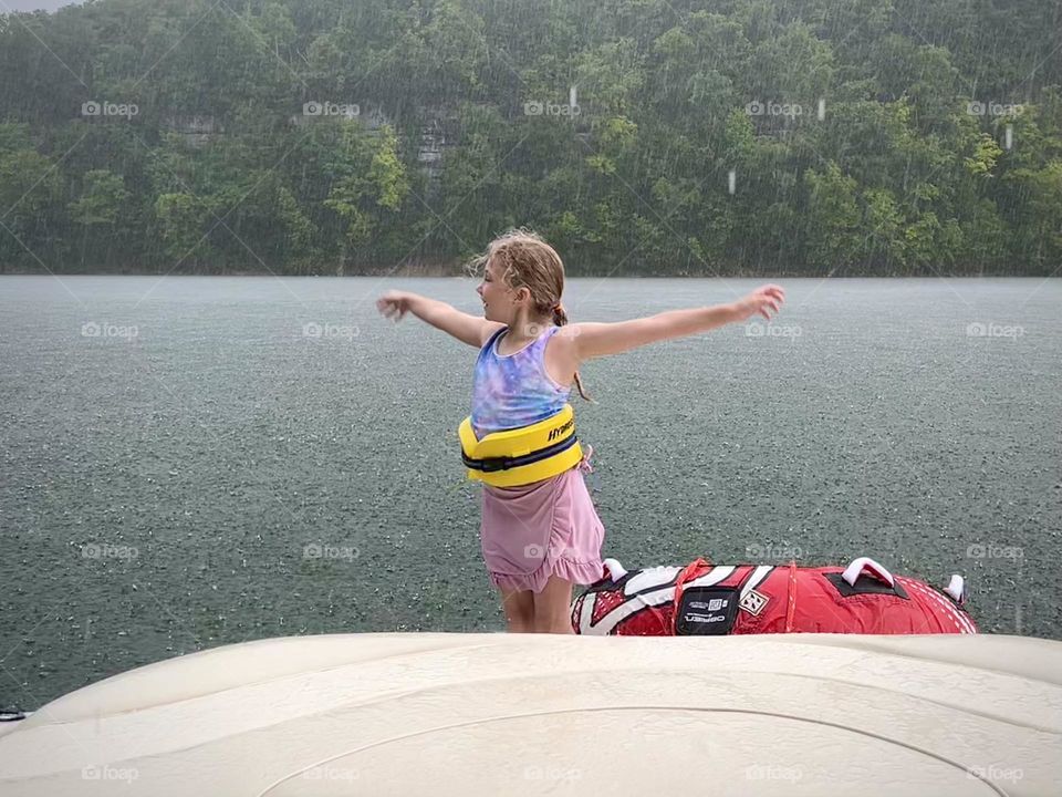 Dancing in the rain out on the lake