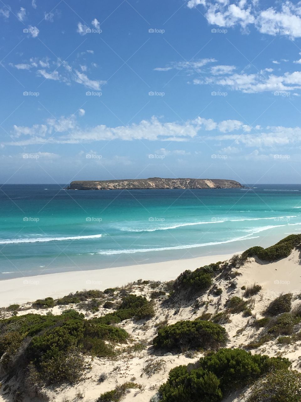 View of Island from secluded remote wild beach and cliffs in south Australia 