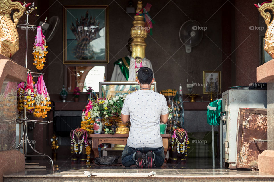 Man pay respect in the temple 