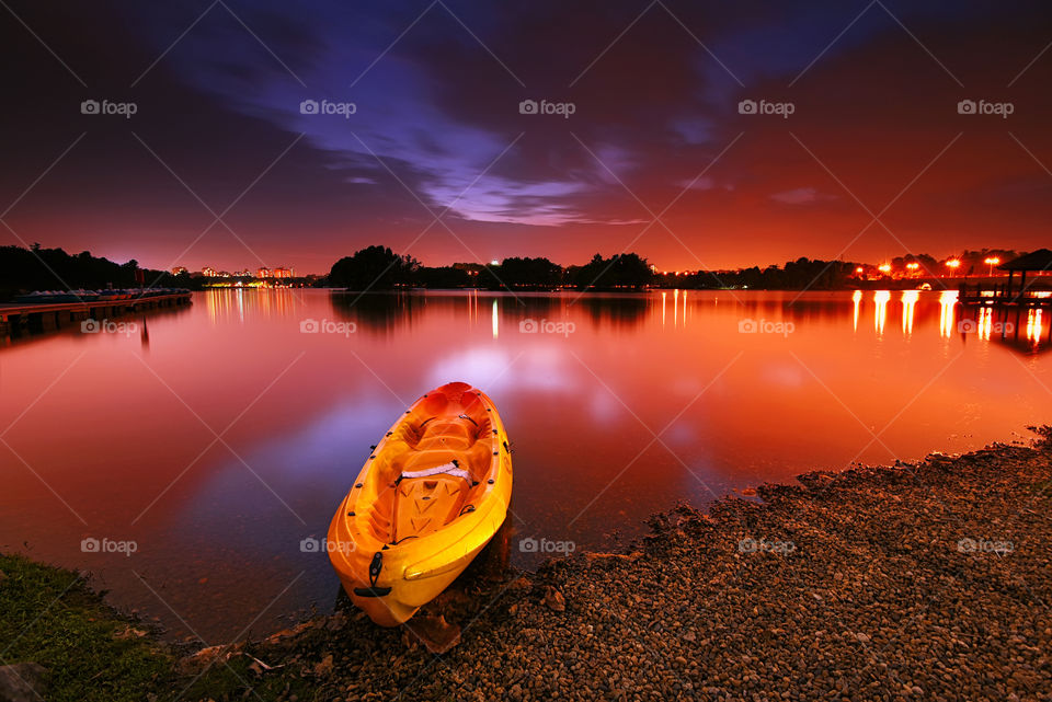 Canoe at Putrajaya Lake on sunset sky