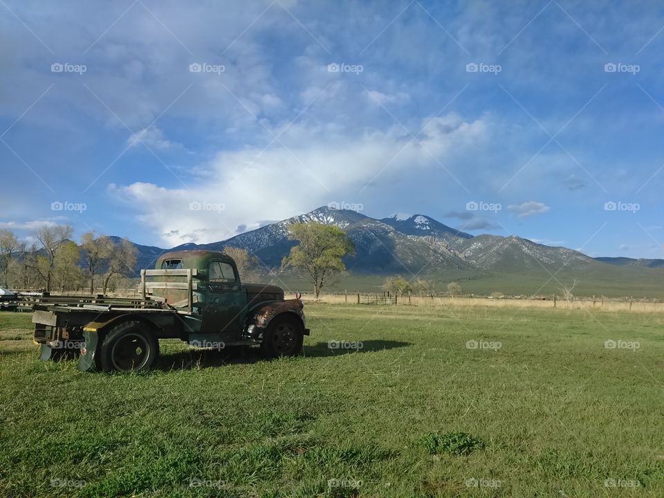 Old farm truck in high Desert mountain field