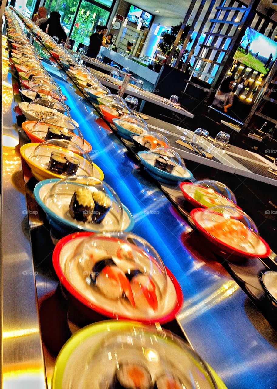 Sushi bar. Eating sushi on the rotary table,Italy 