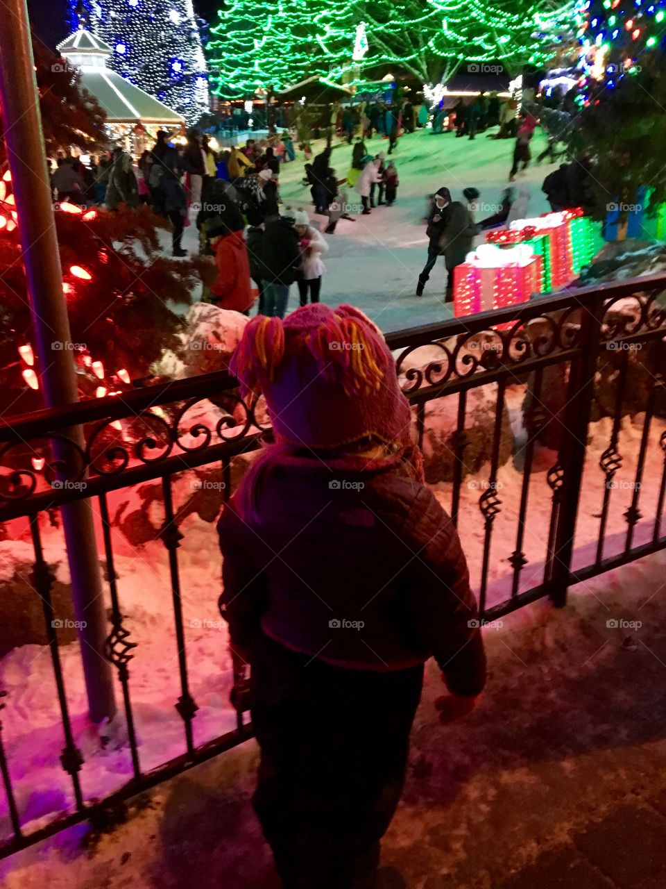 Little girl watching lights.