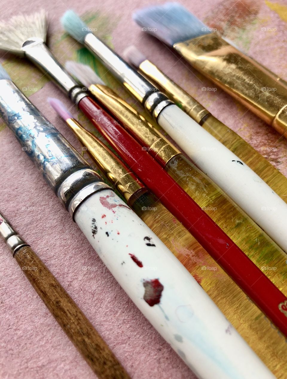 Closeup full frame view of used paintbrushes 