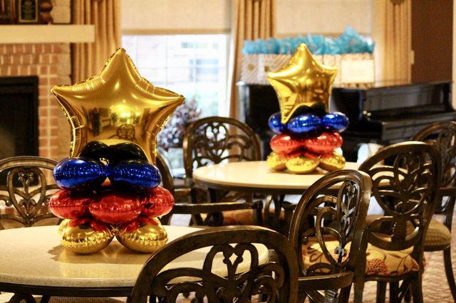 Tables with Gold Star Balloons
