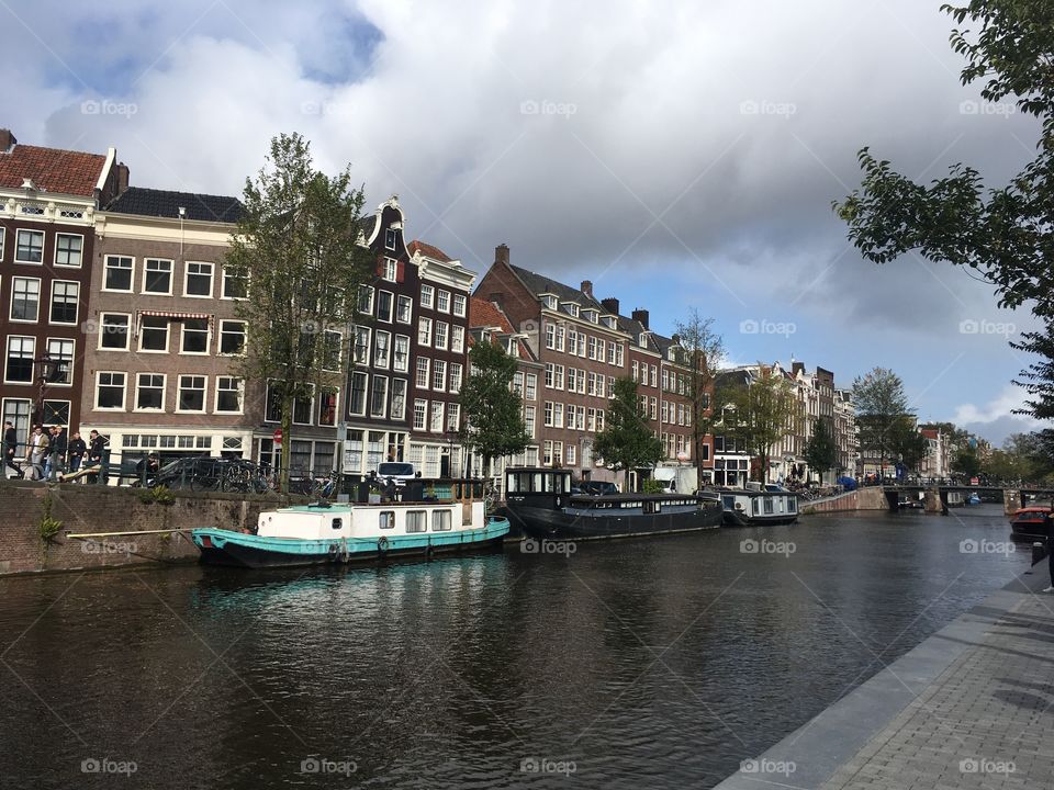 Houses and boats on a canal in Amsterdam 