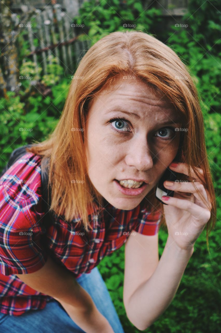 Girl calling with telephone