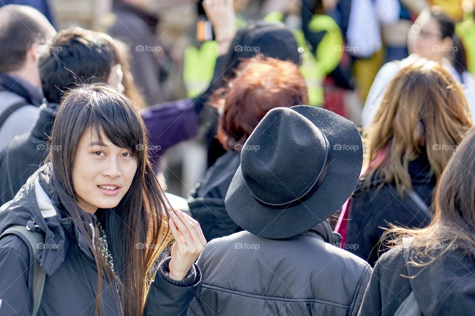 Chinese woman in a crowd 