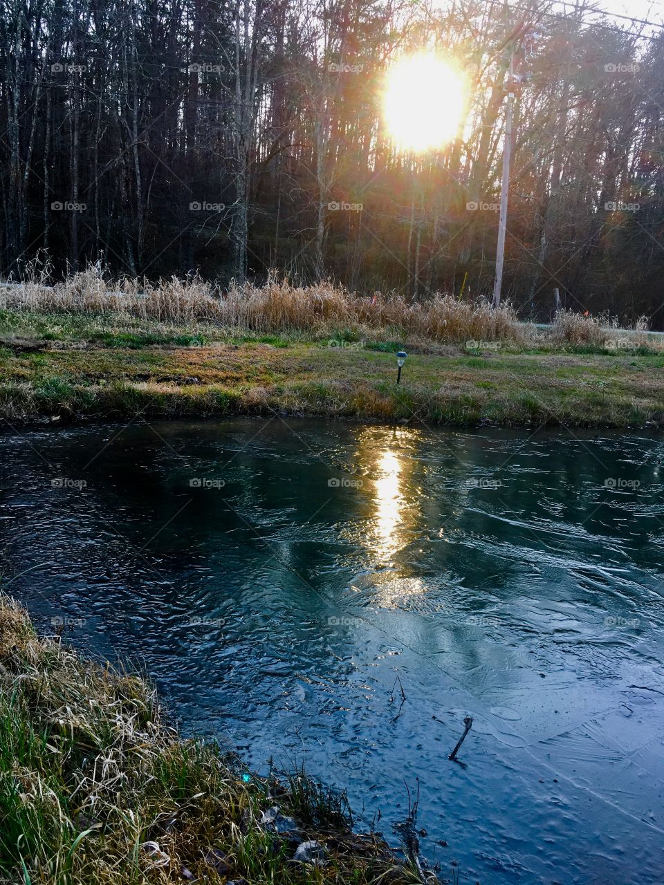 Sun sets on a cold day over Papa’s pond