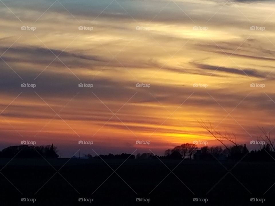 sunset farmland Iowa