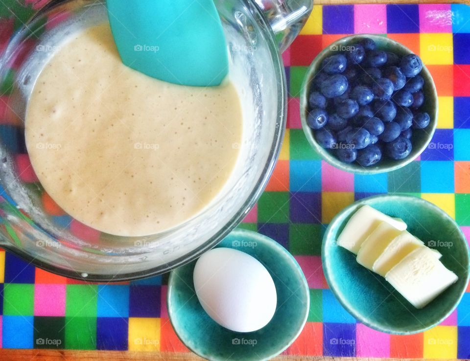 Preparation of pancake batter in bowl and ingredients