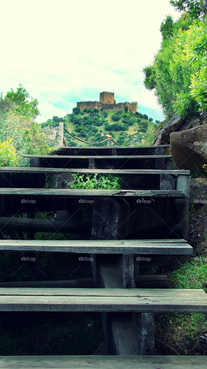 staircase with a distante castle on the horizon. photo taken at Belver in Portugal