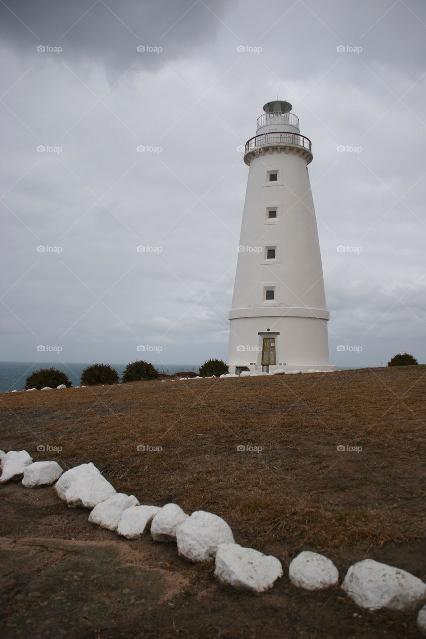 light house stones sea by kshapley