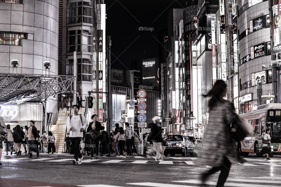 At the Scramble Crossing in Tokyo, Japan. This is the most crossed crosswalk per day in the world. This shot was at around 3am, and we still see a fair number of people. 