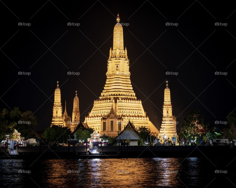 The famous Wat Arun , perhaps better known as the Temple of the Dawn, is one of the best known landmarks and one of the most published images of Bangkok