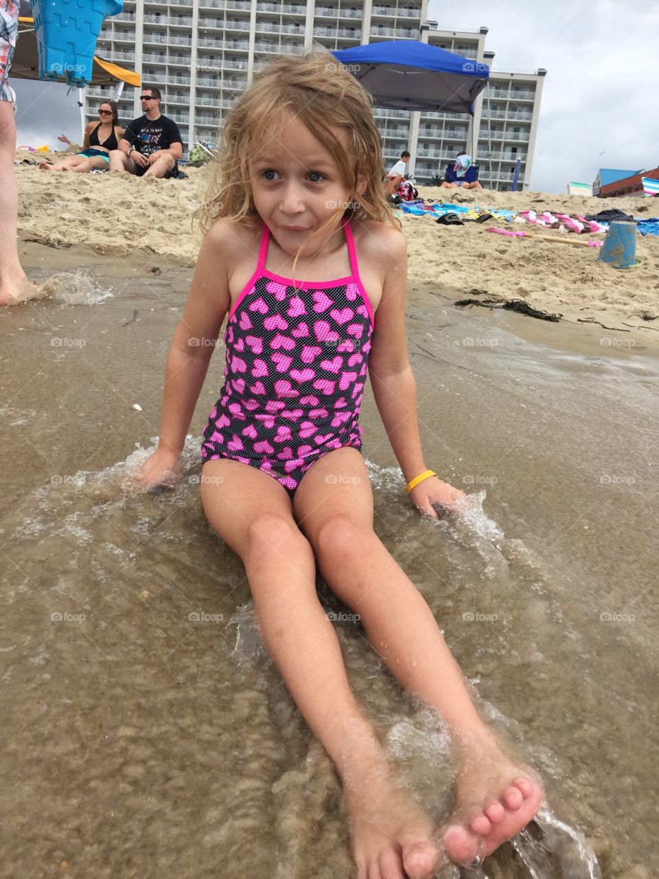 A little girl experiencing her first cold wave of the summer. 