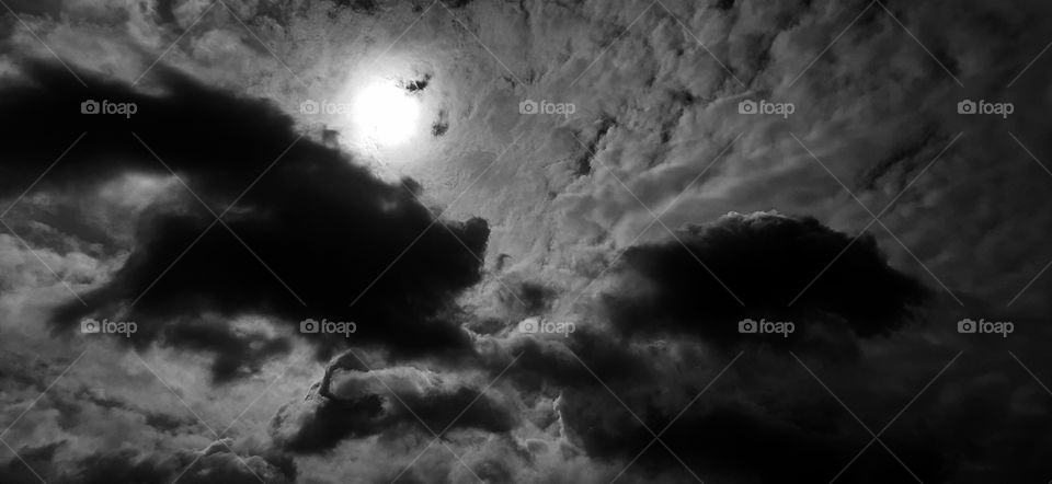 Swirl in the dark dramatic Storm Clouds with Ray of the Light.Black & white photo.A beautiful combination.