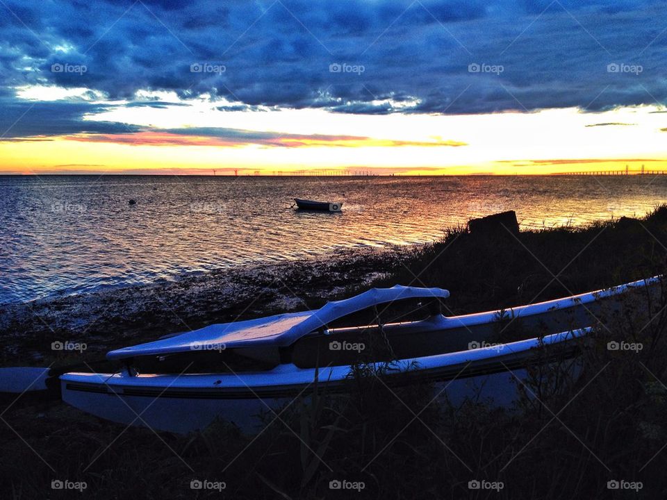 Catamaran on land at dusk