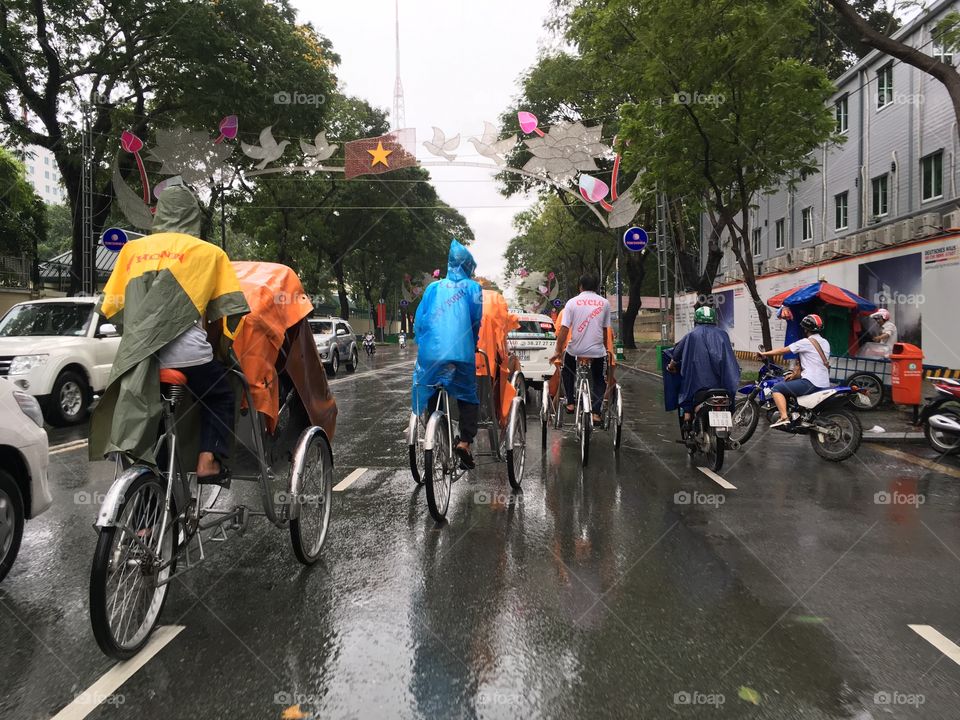Colorful Cyclo drivers on a Cyclo tour in Saigon, Vietnam 