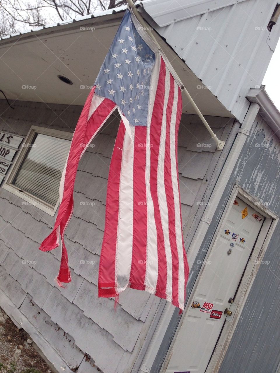 Warren and battered American flag