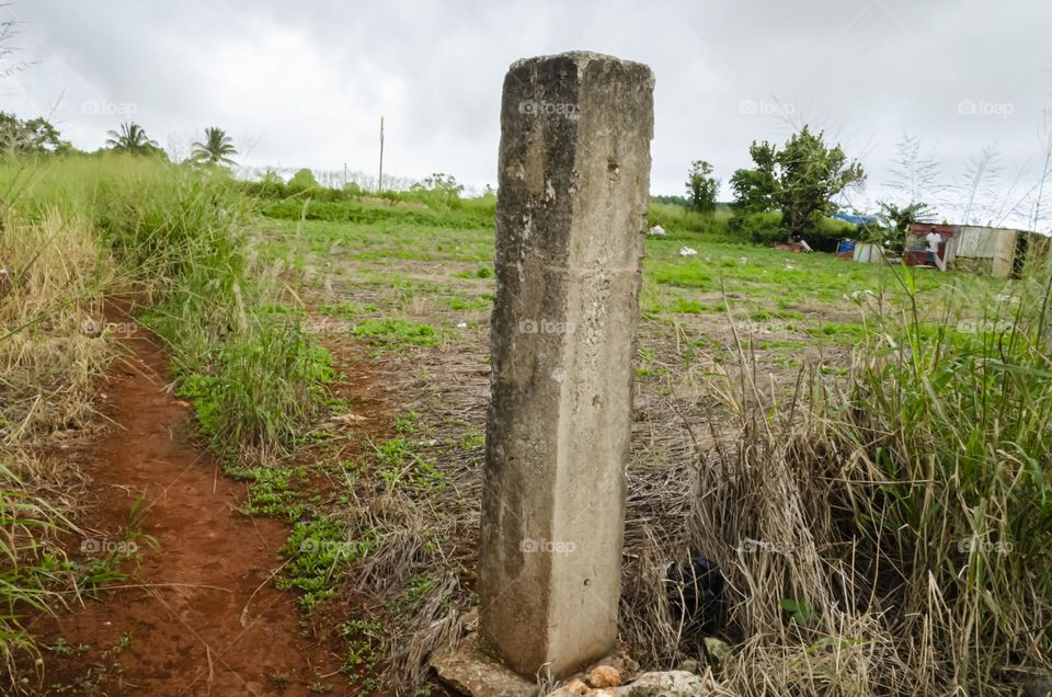 Concrete Column In A Field