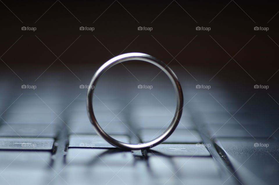 A ring appears on the keyboard of a laptop computer.