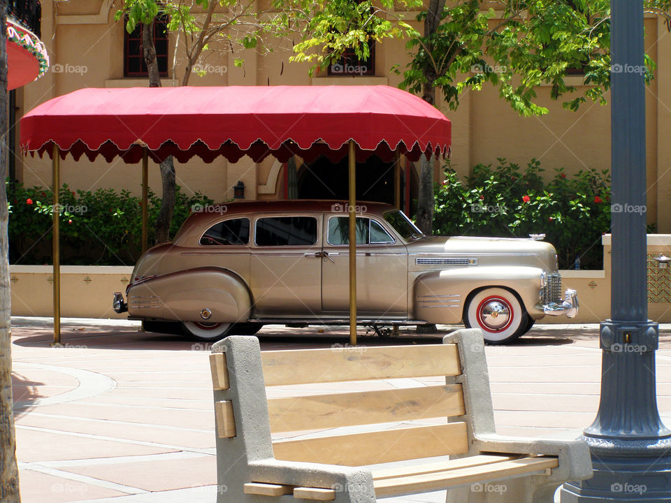 An old timer sitting in the shade at Disney World, Florida