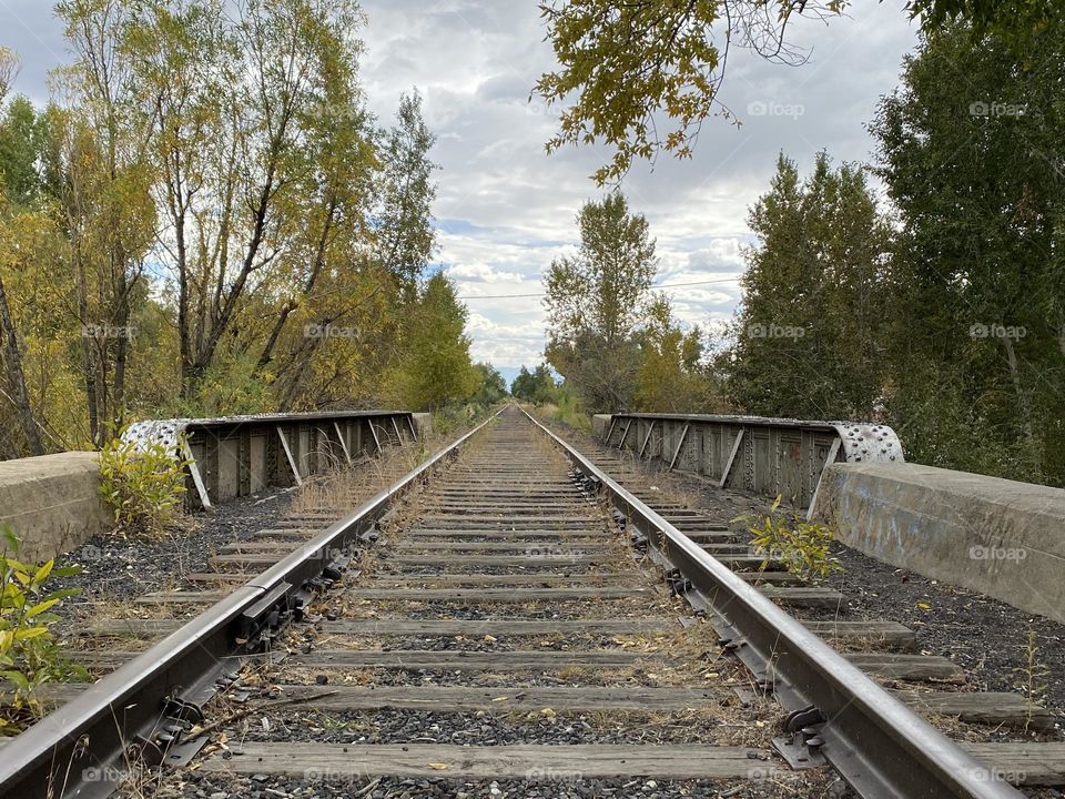 If anyone has ever run away from their problems, that’s why I took this shot. It just reminds me of a lot of past dreams, hopping a train, leaving and never looking back. Perspective wise this photo could be looking back or looking forward. Adventure