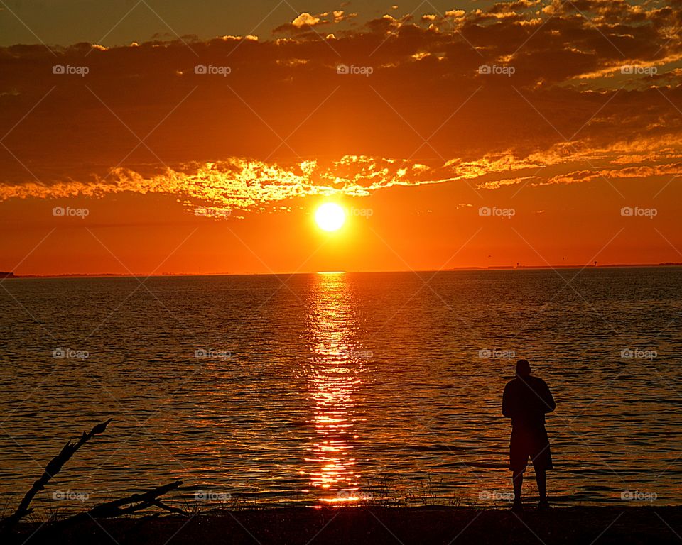 A man observes the magnificent sunset