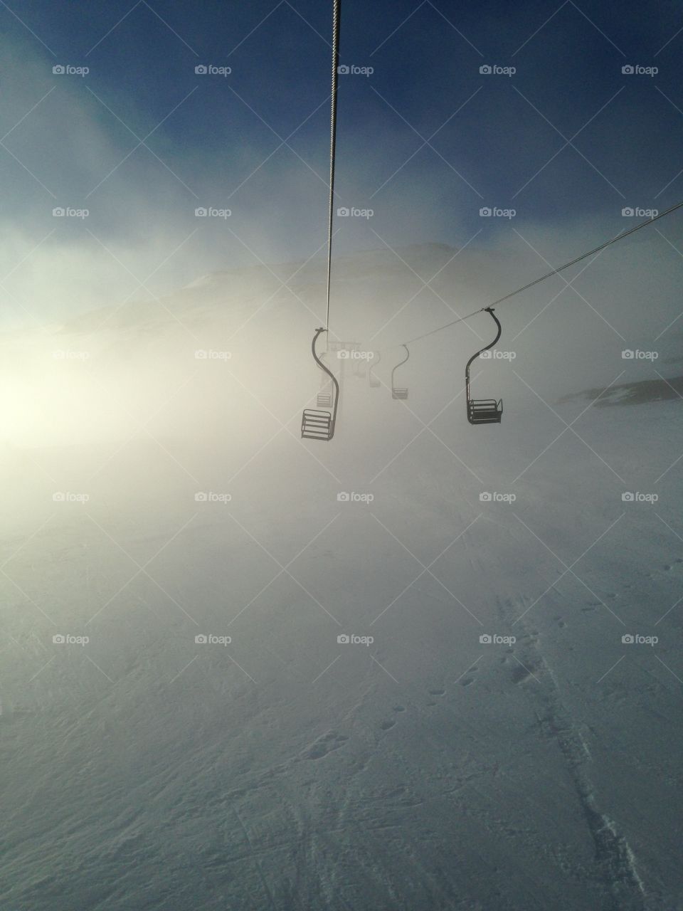 Chairlift looms. Taken at Glencoe Ski Centre.