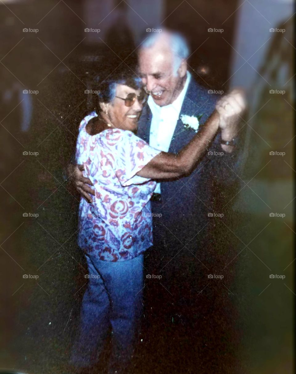 25th Anniversary couple dancing at their party celebrating the event🥂