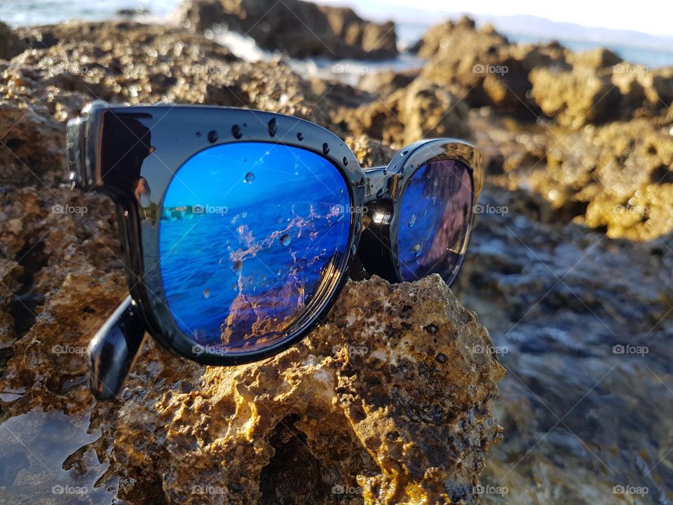 Sunglasses reflection. Vacation and enjoying at the se