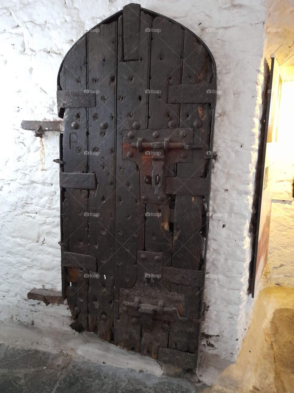 Castle door with character, charm, history, age and bolts, beauty in buildings