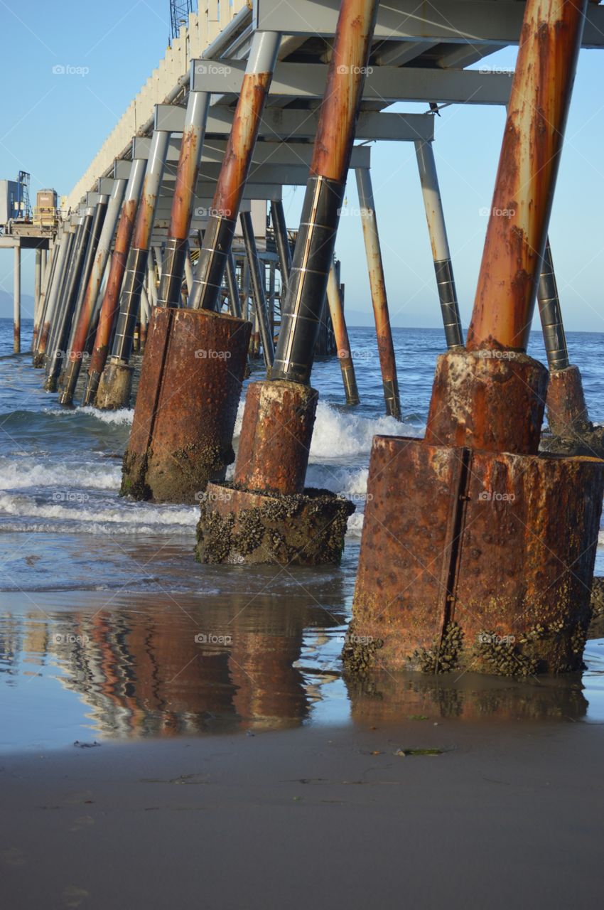 Pier . Walking on the beach in Carpinteria Ca and took this photo under the pier. Loved the rust color
