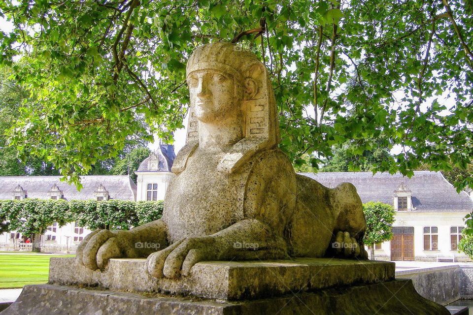 Sphinx statue at garden's entrance to Chenonceau Castle - France