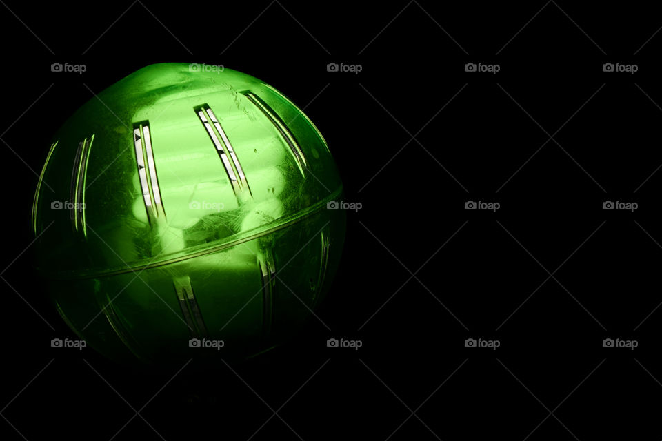 Green Glow Light Bulb. Green glow light bulb is simply a regular light bulb with a green circular cover over it.
