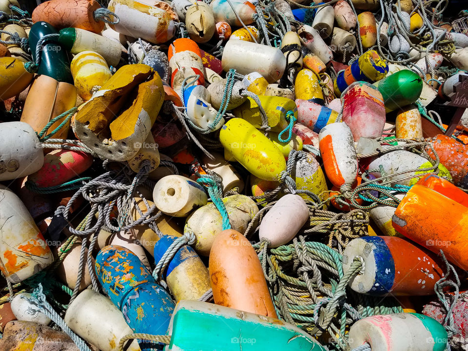 Buoys on top of more buoys in a nautical junkyard