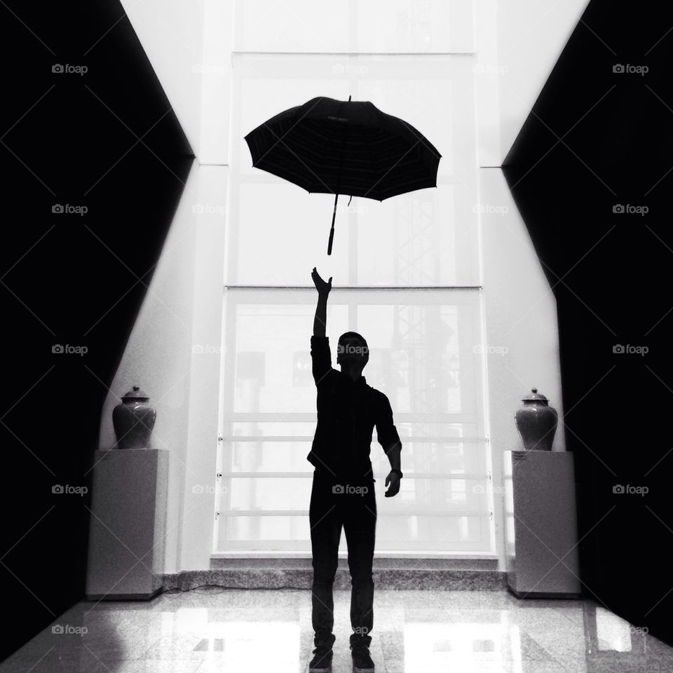 A person catching umbrella