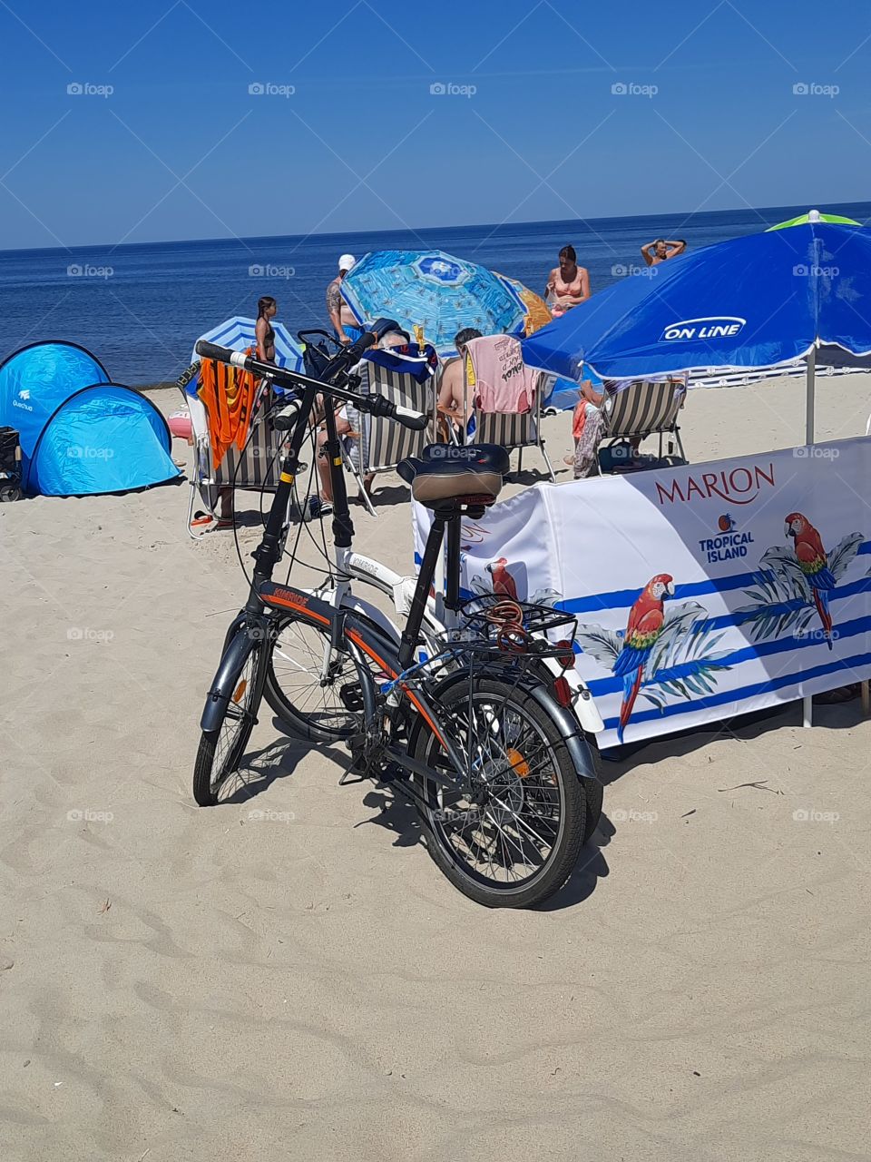 two off road bikes on the beach