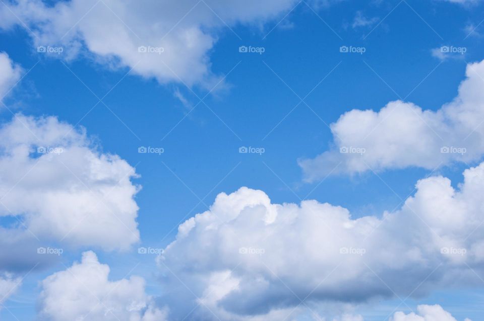 Blue sky and fluffy white clouds