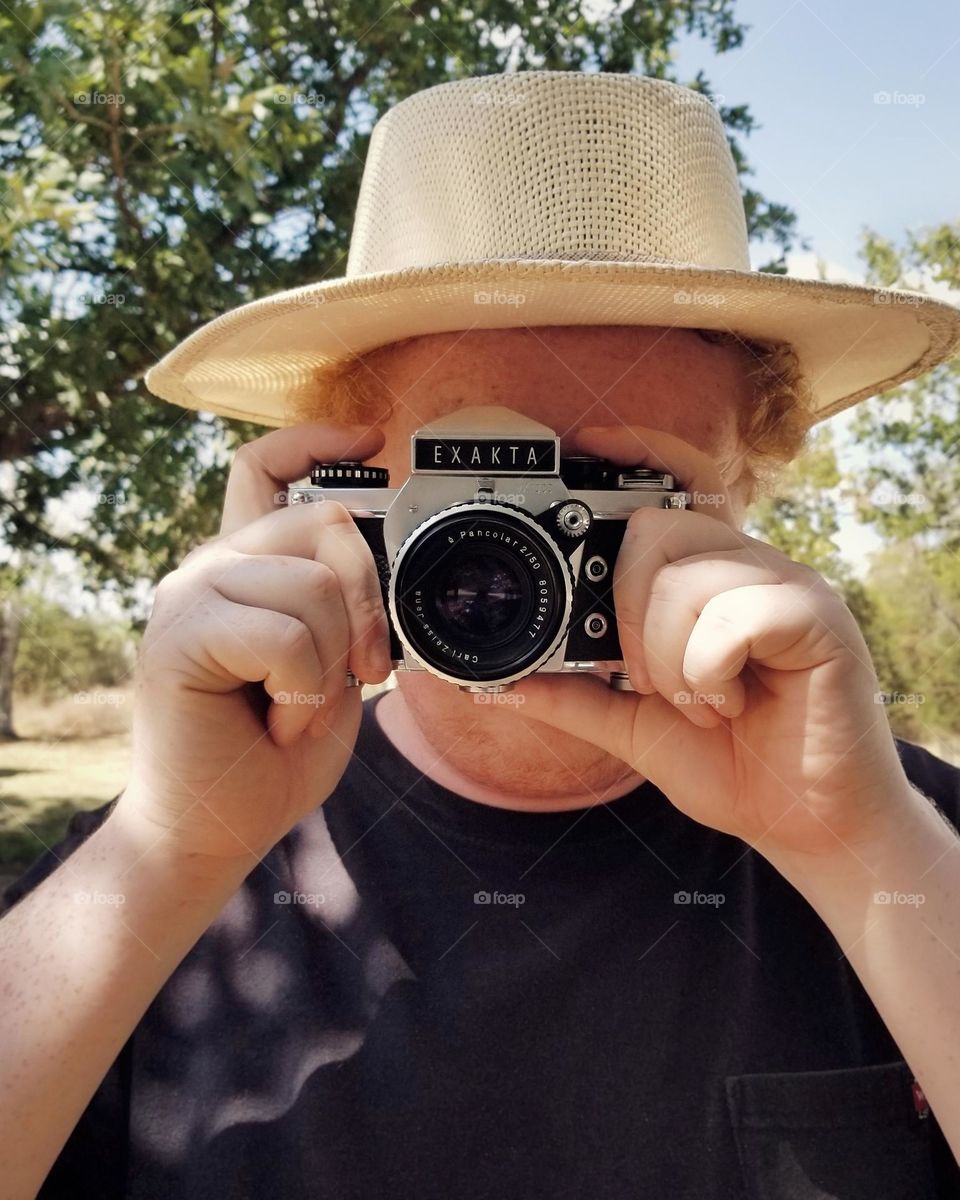 Man taking a photo head on