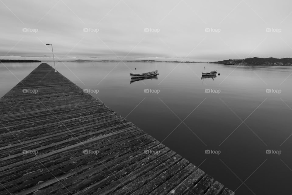 monochrome pier and boats