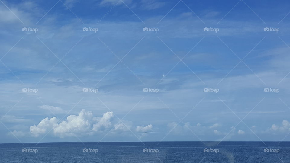 The sky and the ocean become one on a beautiful summer day.