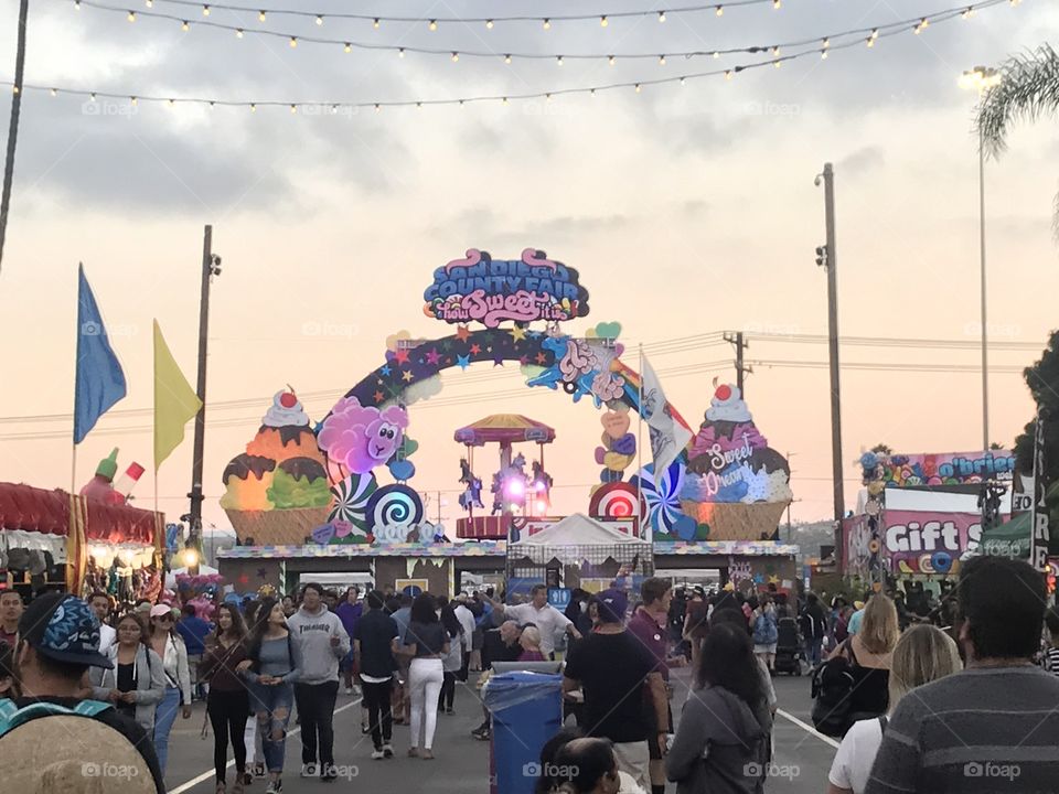 Sweet early evening at the San Diego County Fair, facing the exit, on July 2, 2018, as people both enter and exit the fairgrounds.